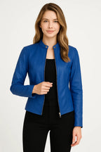 Model wearing the jacket in black, front zip half open over a black top and black trousers