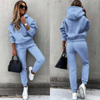 Split view of a pastel blue hoodie and joggers set, front pose and rear view showing the elasticated waistband and hood