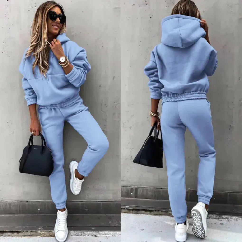 Split view of a pastel blue hoodie and joggers set, front pose and rear view showing the elasticated waistband and hood