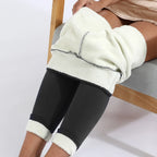 Cropped leggings pulled up over the knee showing the thick fleece interior lining and cuffed ankle hem