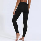 Back view of a woman wearing black high-waisted leggings showing the smooth, sculpting fit