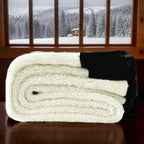 Folded pair of leggings shown from the fleece side, cream fleece lining against black outer fabric on a wooden table