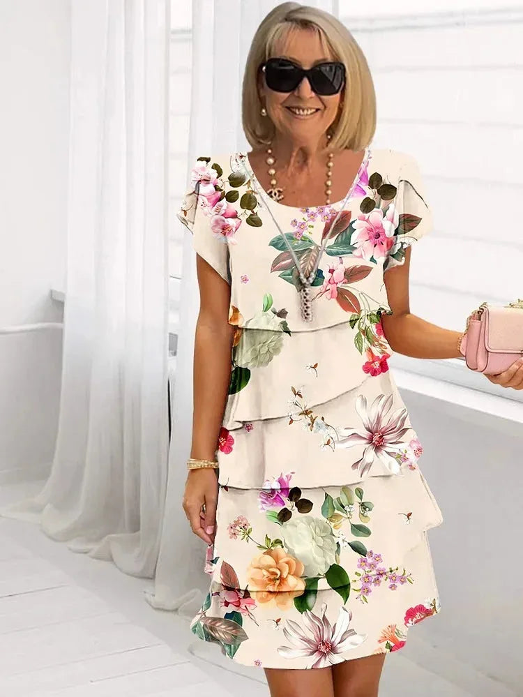 Cream tiered midi dress with multicolour floral print and ruffled layered skirt, round neck short sleeves
