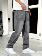 Three-quarter side view of grey jeans showing front pocket detail and leg drape while walking