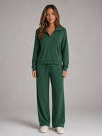 Front view of the loungewear set in dark green, showing the relaxed fit jumper and wide leg trousers
