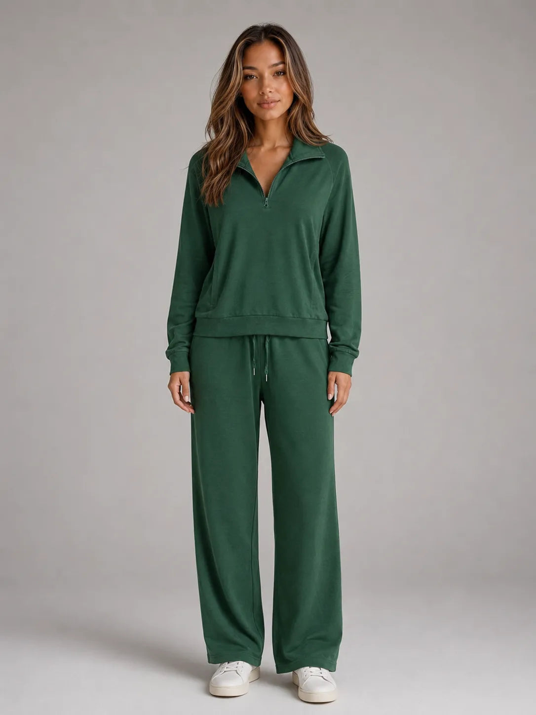 Front view of the loungewear set in dark green, showing the relaxed fit jumper and wide leg trousers