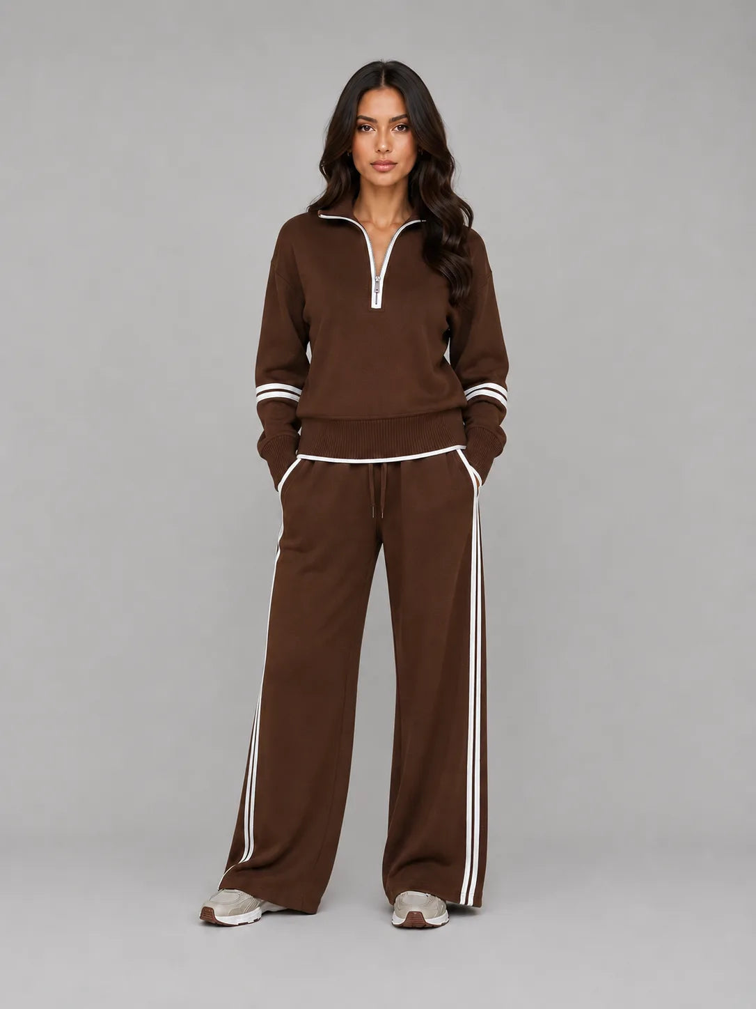 Front view of brown half zip lounge sweatshirt and wide leg trousers with white stripe trim