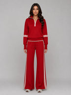 Front view of red half zip lounge sweatshirt and wide leg trousers with cream stripe detailing