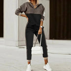Half-zip tracksuit in black with grey checked panels on the top, sleeve and trouser side stripe