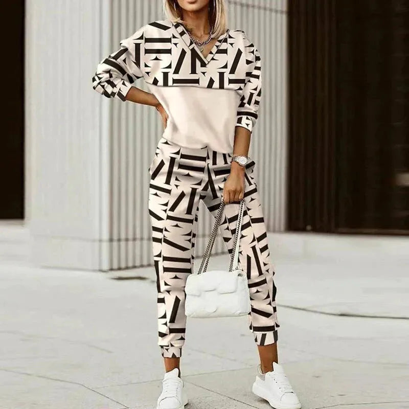 Two-piece set in cream with an oversized black geometric print covering the top and jogger trousers