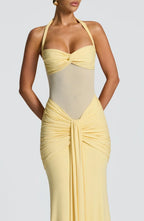 Close-up of the yellow gown's twist bandeau bust, sheer midriff mesh and ruched draped front detail