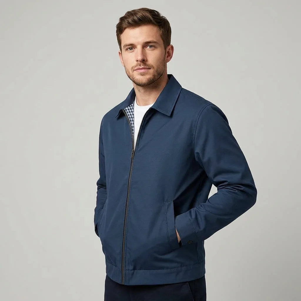Man in navy blue harrington jacket, side angle showing collar shape and fit