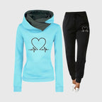 Light blue hoodie with contrast grey hood lining and heart print, styled with black joggers and trainers