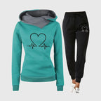 Teal green hooded top with heartbeat heart design and kangaroo pocket, worn with black jogging bottoms