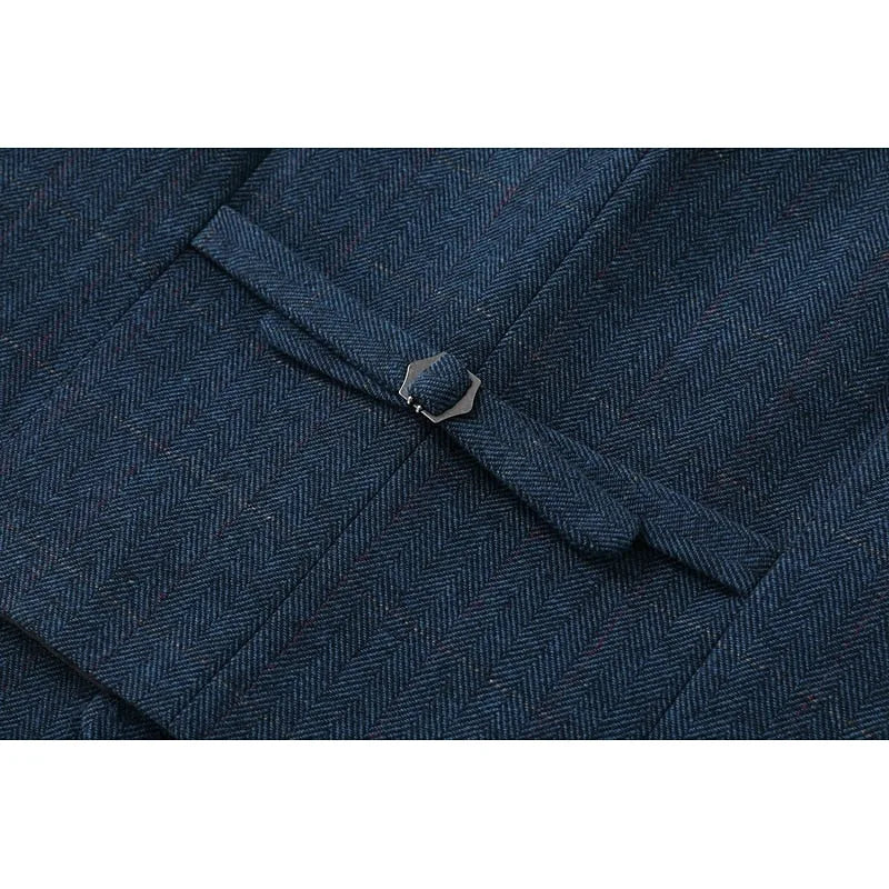 Textured close-up of the navy herringbone wool-look fabric showing the fine diagonal weave pattern