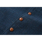 Macro shot of the herringbone weave fabric with brown button fastenings on the waistcoat