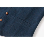 Detail view of the front welt pocket and button placement on the navy waistcoat