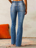 Rear view of blue flared jeans showing classic five-pocket styling and contoured waistband stitching