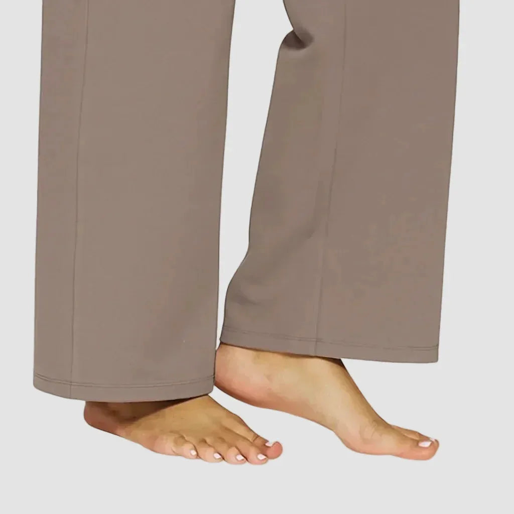 Close-up of the wide hem and straight leg line falling over bare feet