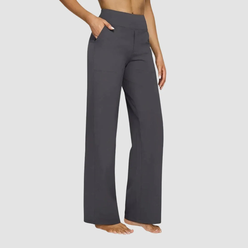 Front hem detail showing the flowing wide-leg silhouette in taupe