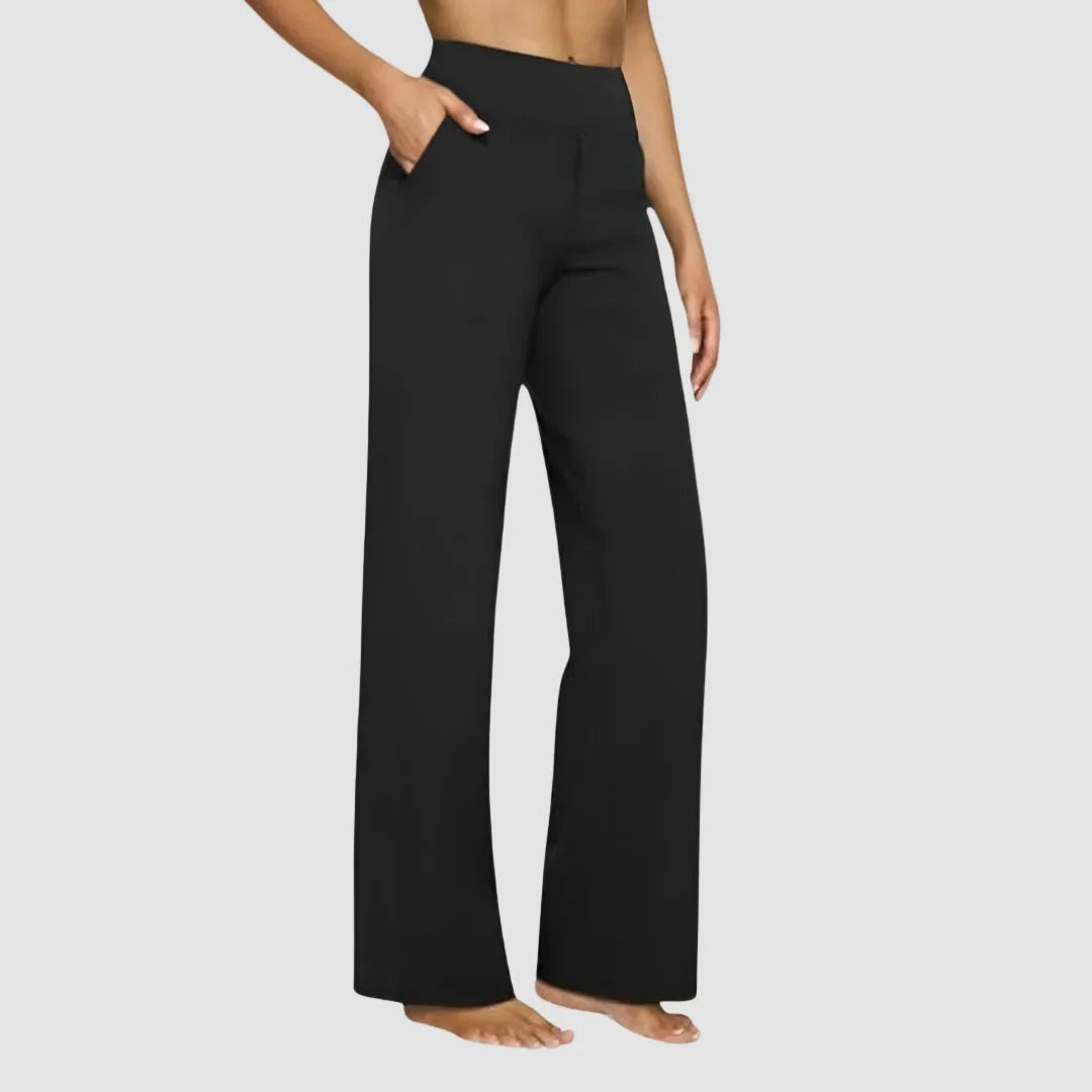 Side view of the trousers in white with visible front pocket and high waistband