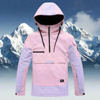 Pink and lilac colour-block hooded anorak jacket with front zip pocket, shown against a mountain backdrop