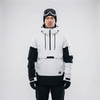Front view of the white and black half-zip ski jacket with drawstring hood and kangaroo pocket, studio shot