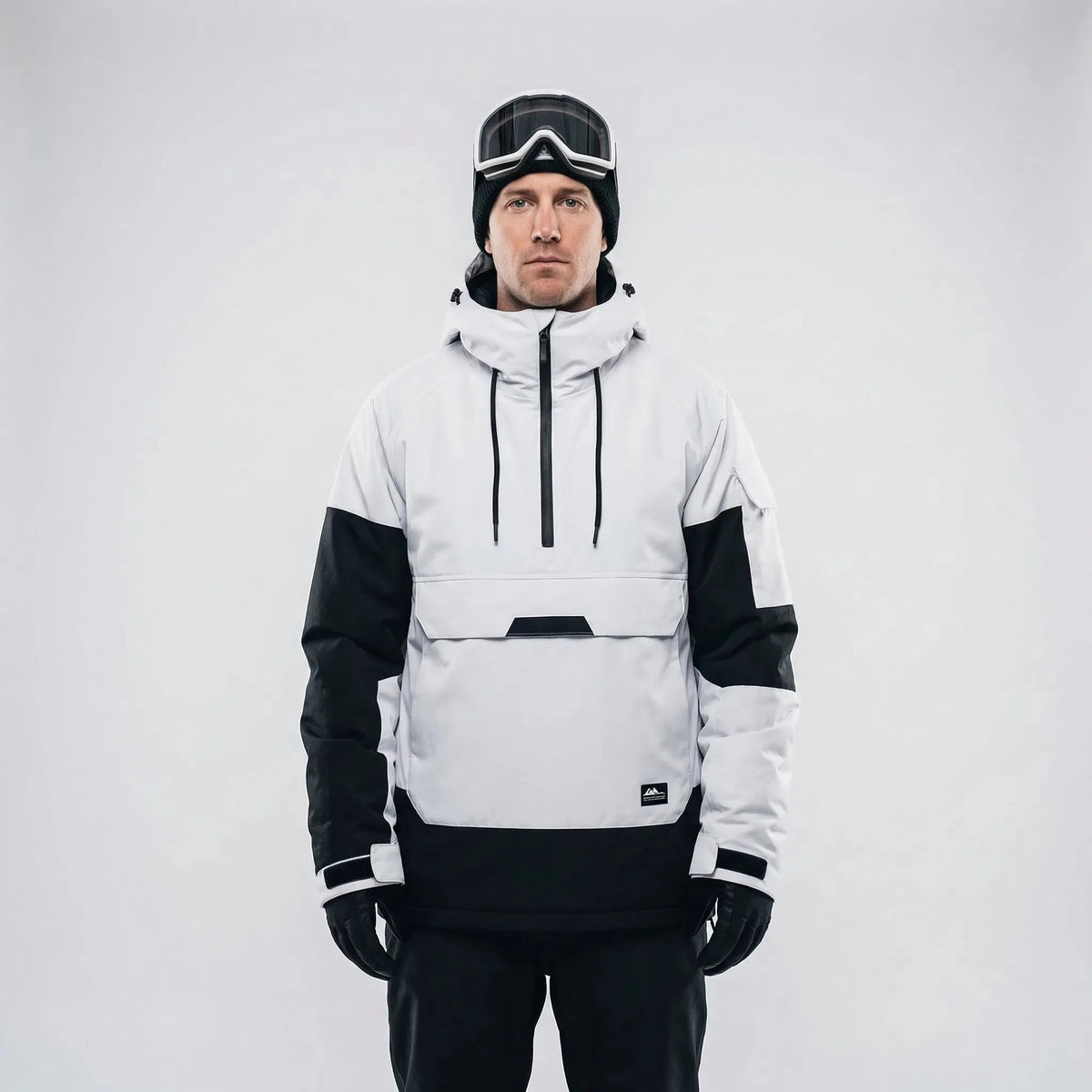 Front view of the white and black half-zip ski jacket with drawstring hood and kangaroo pocket, studio shot