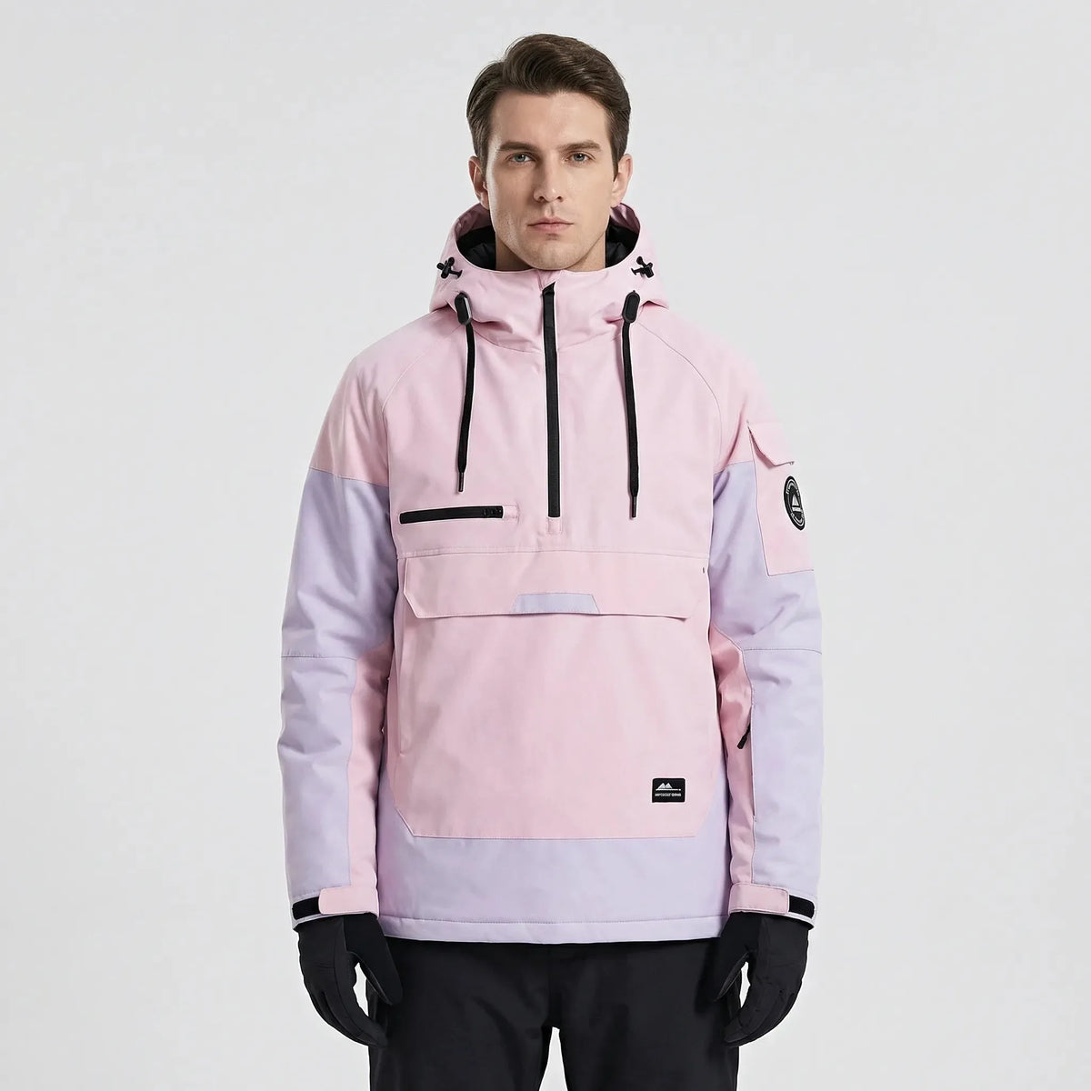 Model wearing the anorak in pink and lilac colourblock, front view with hood resting on shoulders