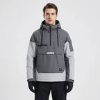 Model wearing the anorak in grey and light grey colourblock, front view showing kangaroo pocket