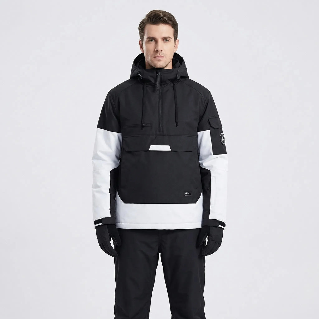 Model wearing the anorak in black and white colourblock, front view with hood down