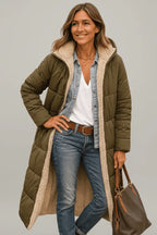 Woman wearing an army green hooded puffer coat with beige lining, holding a brown tote bag