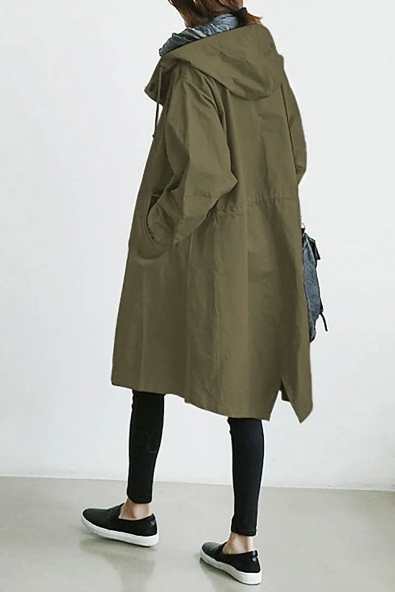 Back view of an army green hooded trench coat showing the drawstring waist and oversized silhouette
