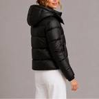 Back and side angle of the black puffer jacket highlighting the ribbed cuffs and rounded hood