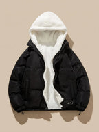 Black puffer jacket with hood fully open, laid flat, showing cream sherpa fleece hood lining