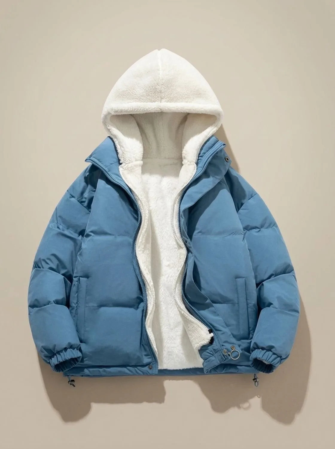 Close-up of hood drawcord and fleece trim on black puffer jacket