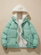 Back view of pink puffer jacket on model showing quilted back panels