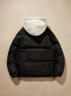 Back view of black puffer jacket showing quilted panels and cream sherpa fleece hood