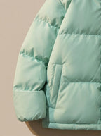 Close-up of elasticated hem drawcord toggle on puffer jacket