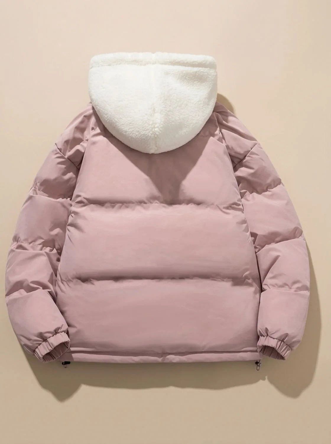 Back view of pink puffer jacket showing quilted panels and cream sherpa fleece hood