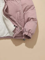 Front view of black puffer jacket with hood up, modelled, showing relaxed oversized fit