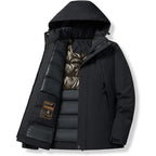 Black winter jacket unzipped, close-up of gold Outdoor Sport patch and shimmering quilted inner lining