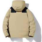 Back view of khaki hooded jacket showing navy contrast panels across the shoulders and hood