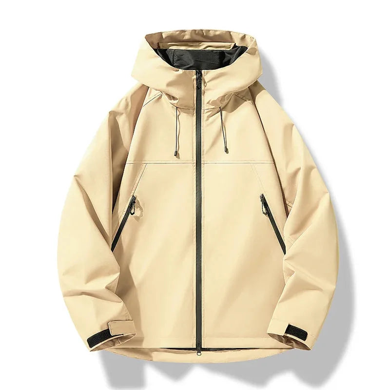 Beige hooded shell jacket with high collar, zip-up front and adjustable cuff tabs