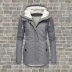 Grey hooded winter coat with sherpa fleece lining, drawstring hood and zip closure
