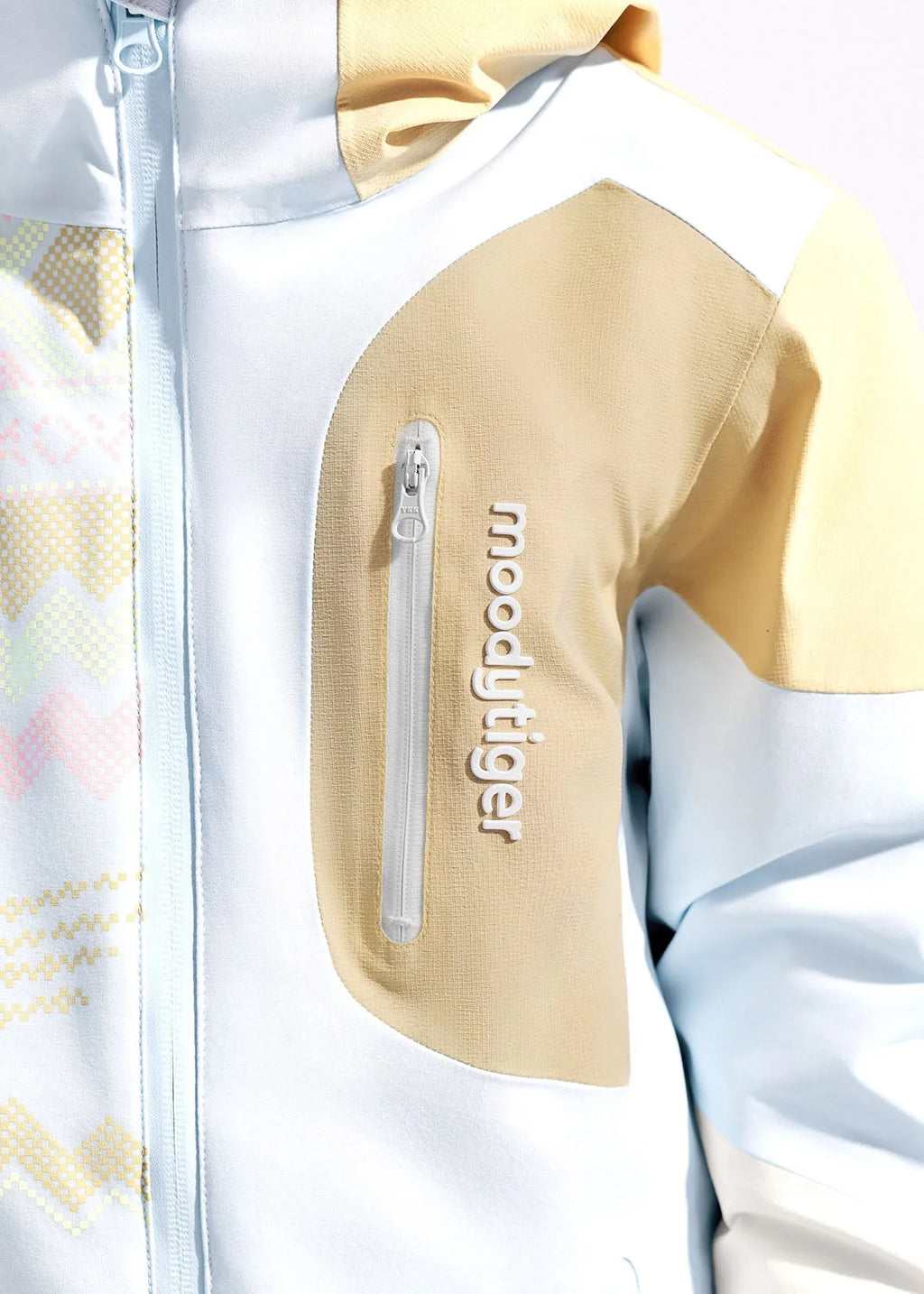 Close-up of hood and collar area showing tan and pale blue colour-block stitching and zip garage