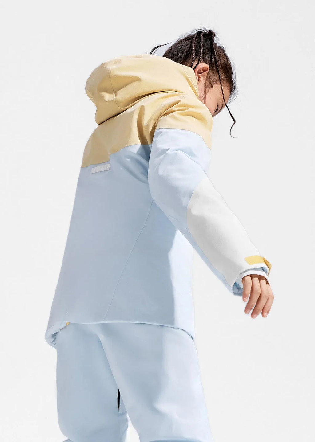 Back view detail of the jacket showing the adjustable hem and contrast panel construction