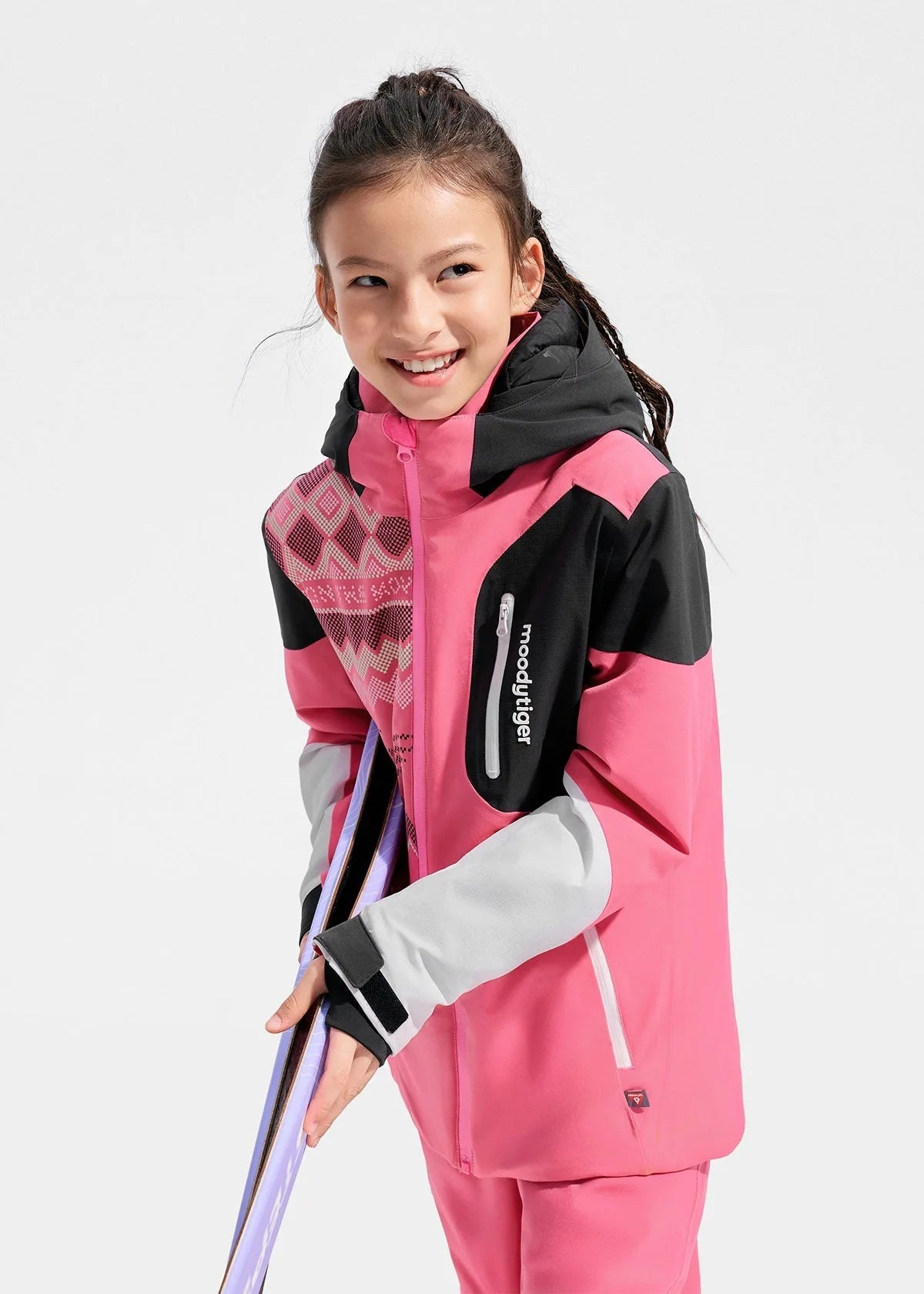 Close-up of the chest zip pocket with branded pull tab and reflective piping detail