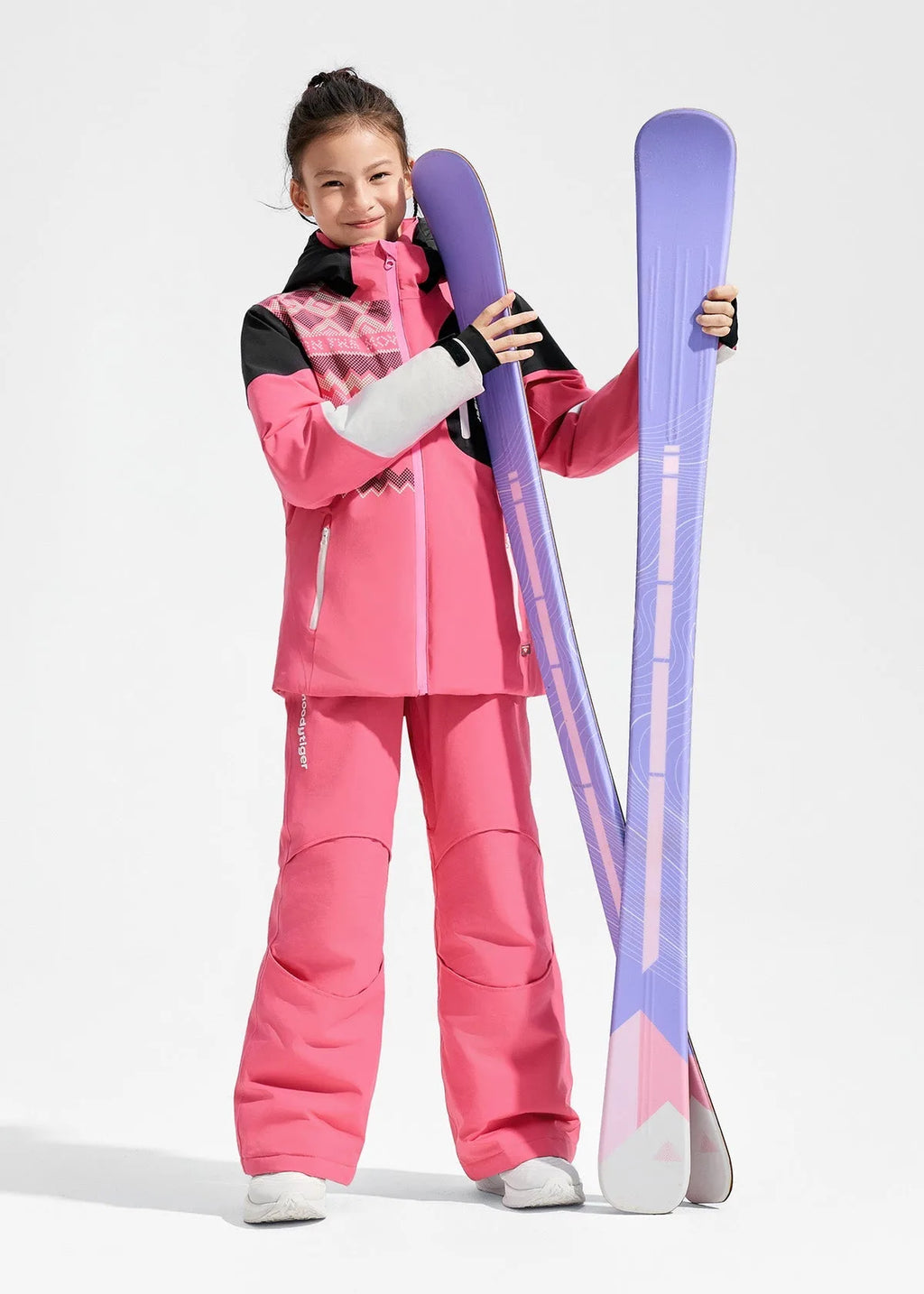 Front view of pink ski jacket with black shoulder panels and knitted-pattern print, paired with matching pink salopettes