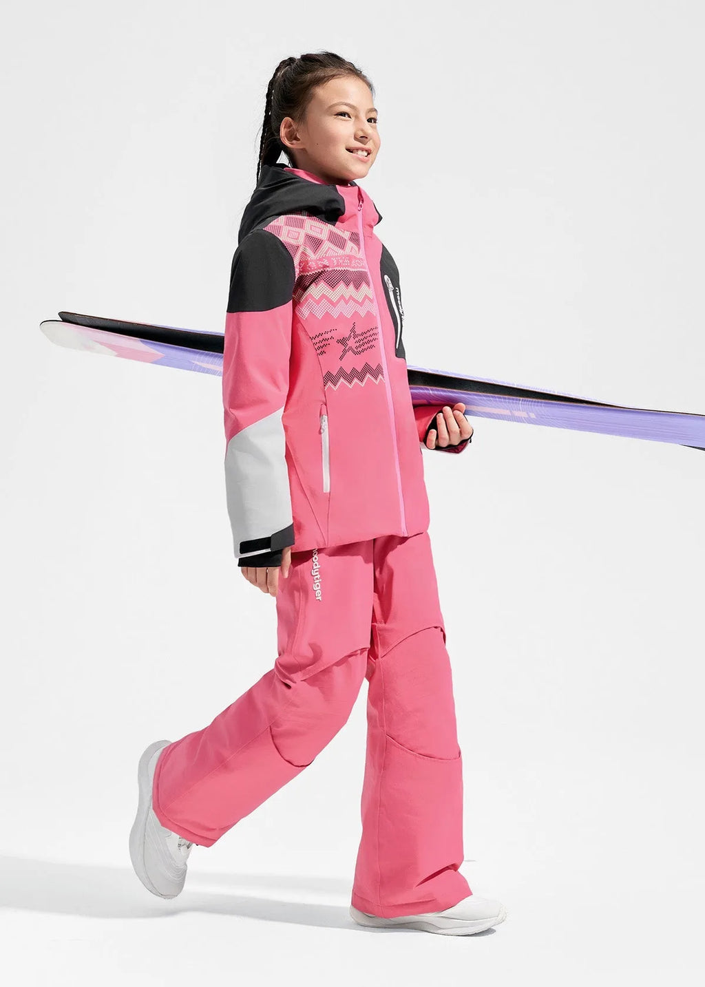 Side profile of pink ski jacket showing white sleeve panel and reflective zip pockets while carrying skis